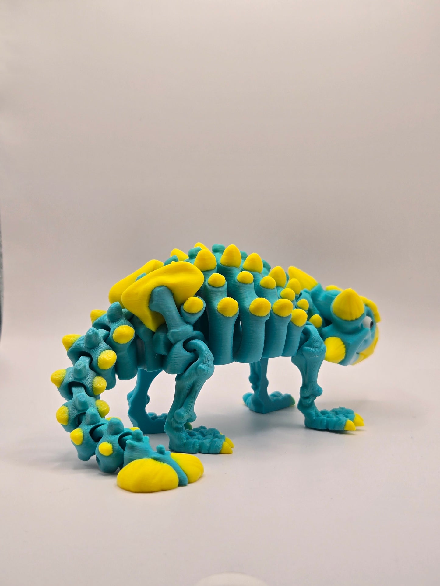 Dinozaurs akrobāts - tirkīzs