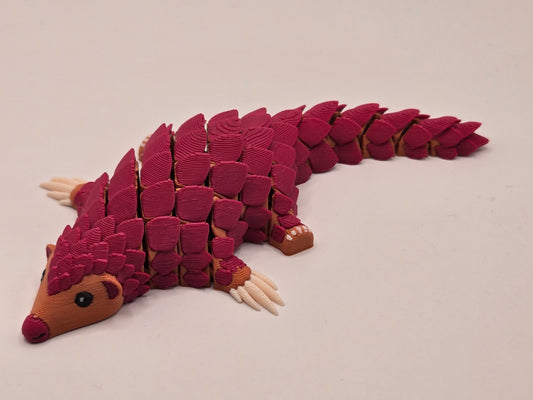 Mini pangolīns sarkans