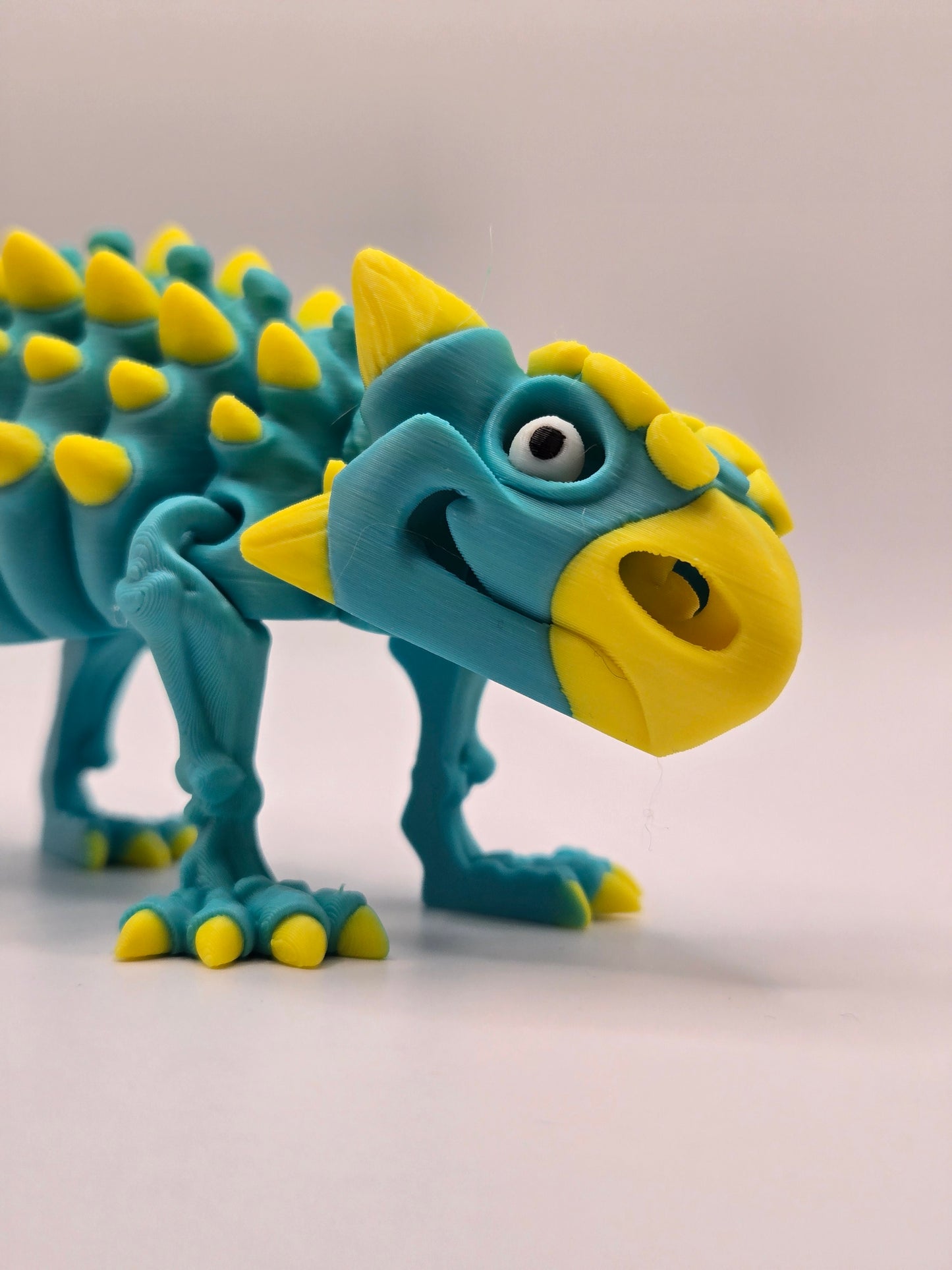 Dinozaurs akrobāts - tirkīzs