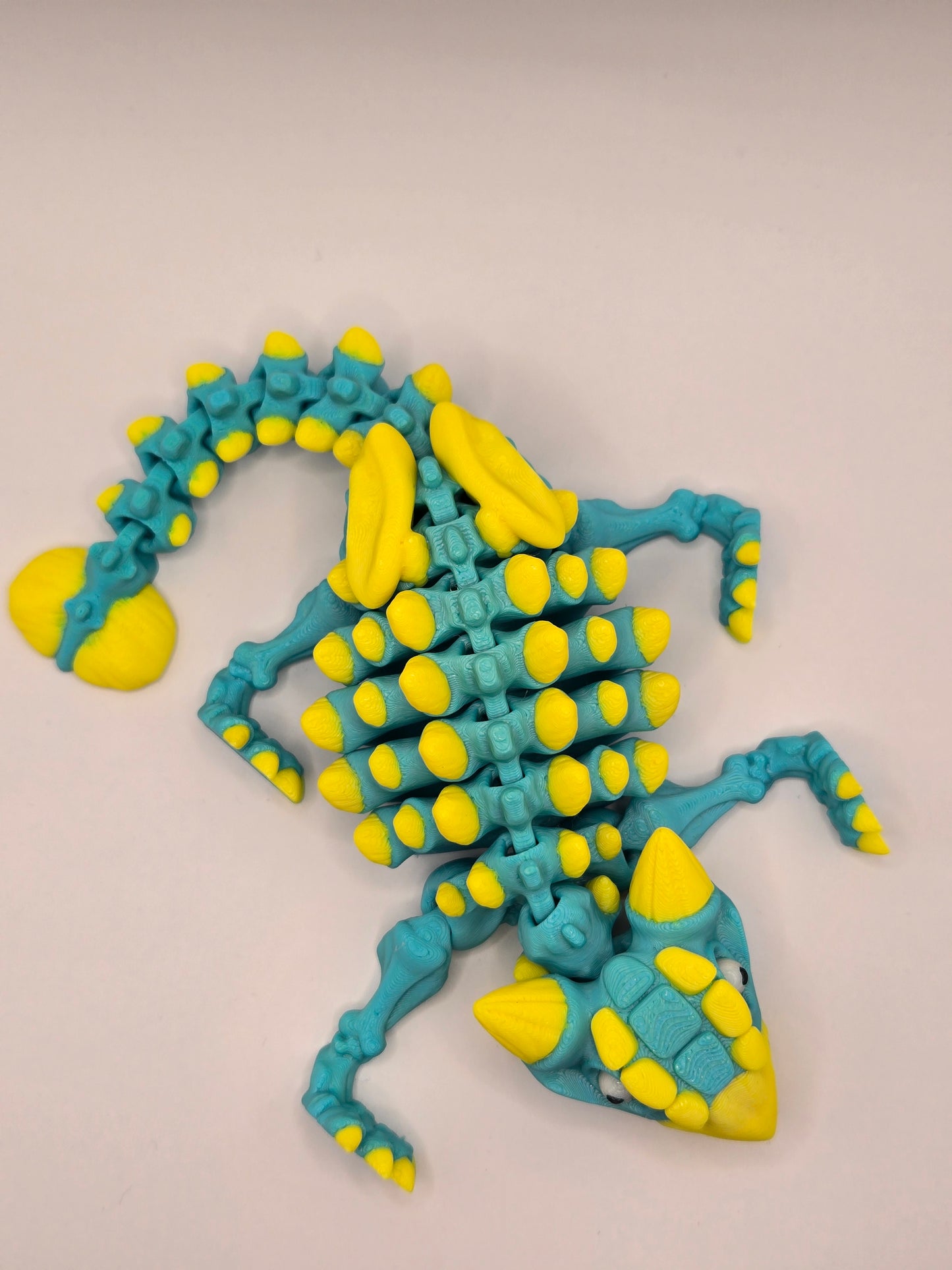 Dinozaurs akrobāts - tirkīzs