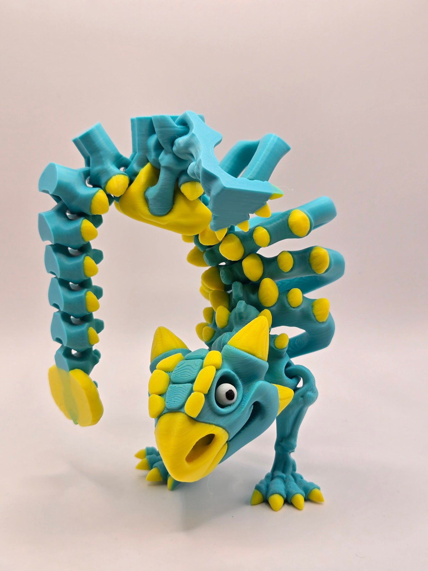 Dinozaurs akrobāts - tirkīzs